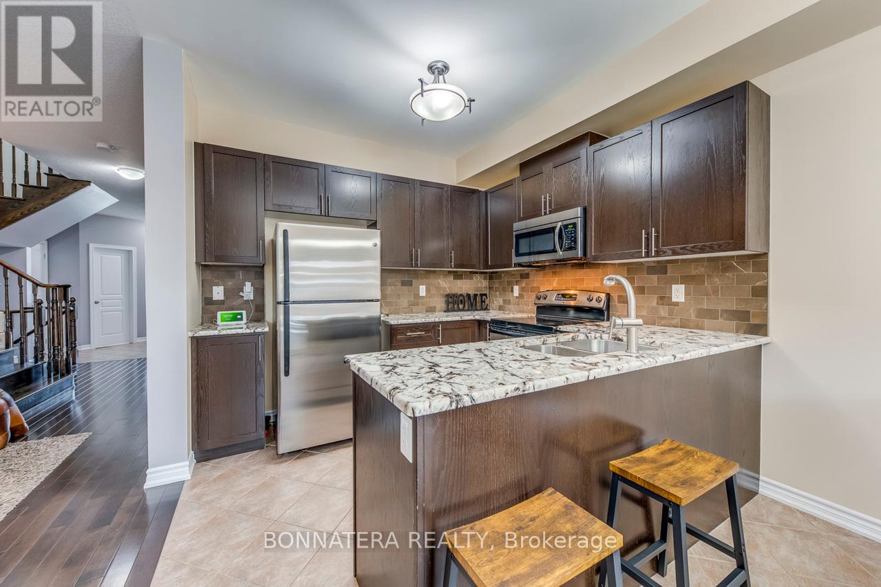 Photo 10 of 654 Murray Meadows Place, Milton ON
