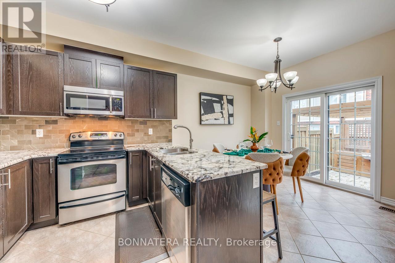 Photo 11 of 654 Murray Meadows Place, Milton ON