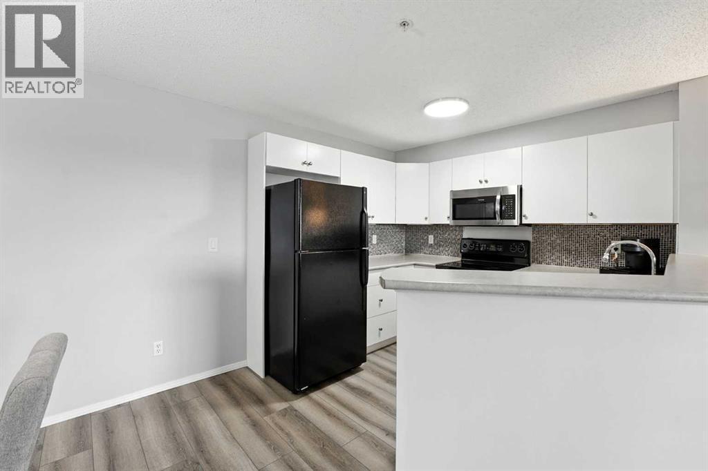 Photo 7 of 7204 304 Mackenzie Way Sw, Airdrie AB