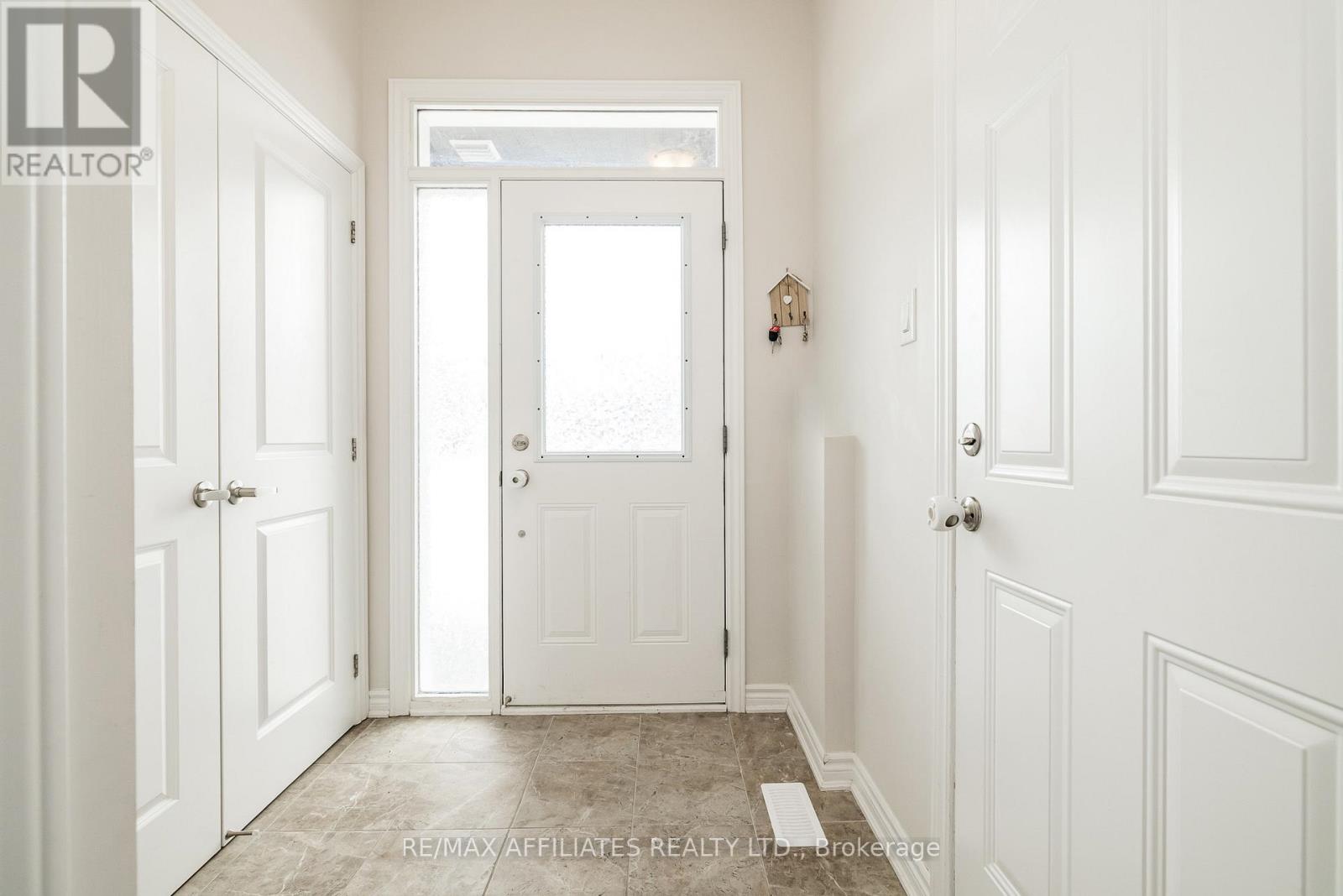 Tiled Entrance w/Garage Entry