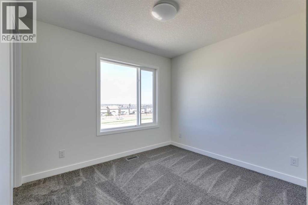 Photo 30 of 1410 25 Wildwoods Court Sw, Airdrie AB