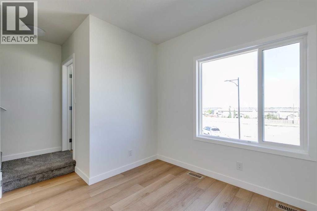 Photo 3 of 1410 25 Wildwoods Court Sw, Airdrie AB