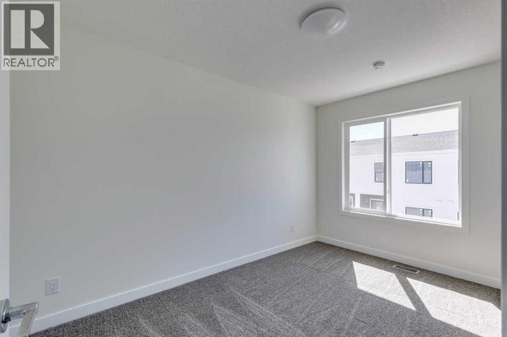 Photo 7 of 1410 25 Wildwoods Court Sw, Airdrie AB