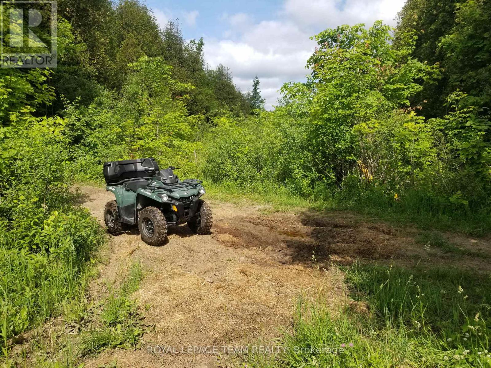 Where land borders side road.