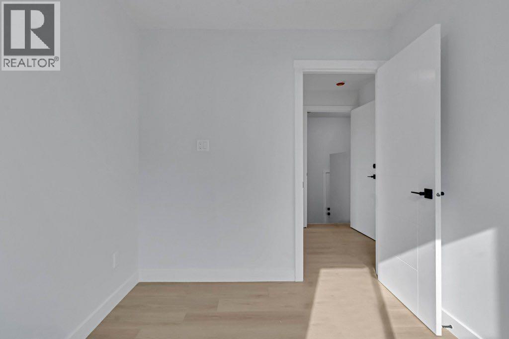 Photo 15 of 231 Penmeadows Close Se, Calgary AB