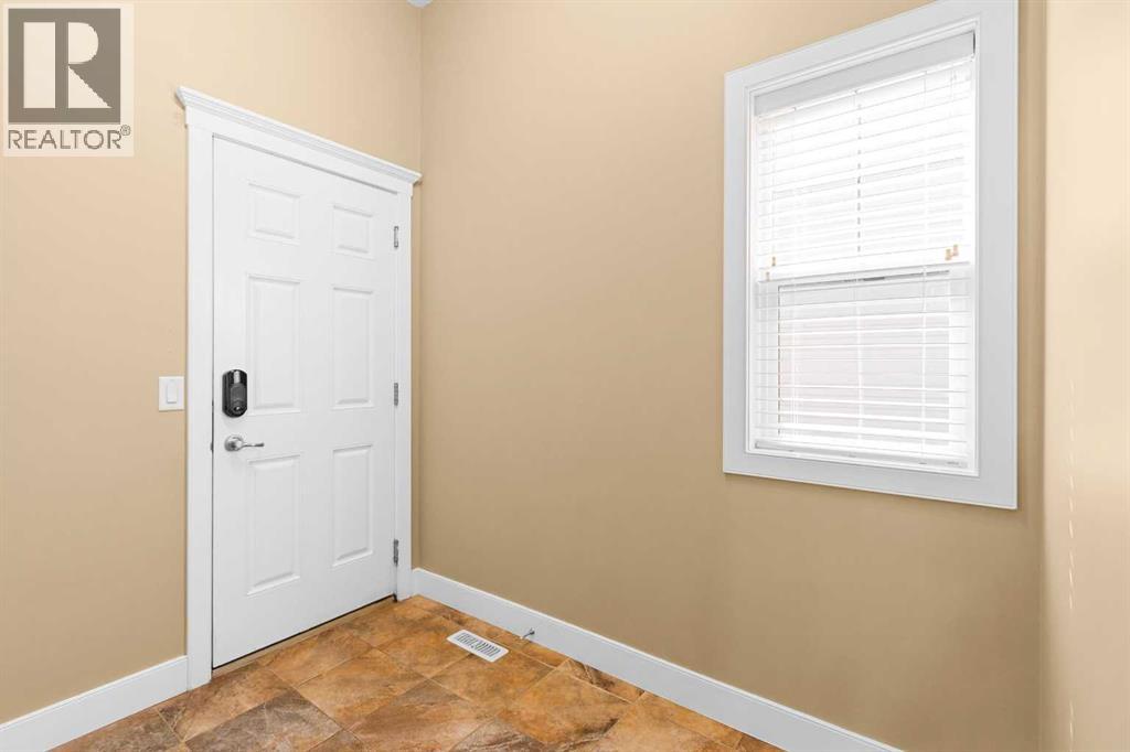 Photo 17 of 117 Kingsland Court Se, Airdrie AB