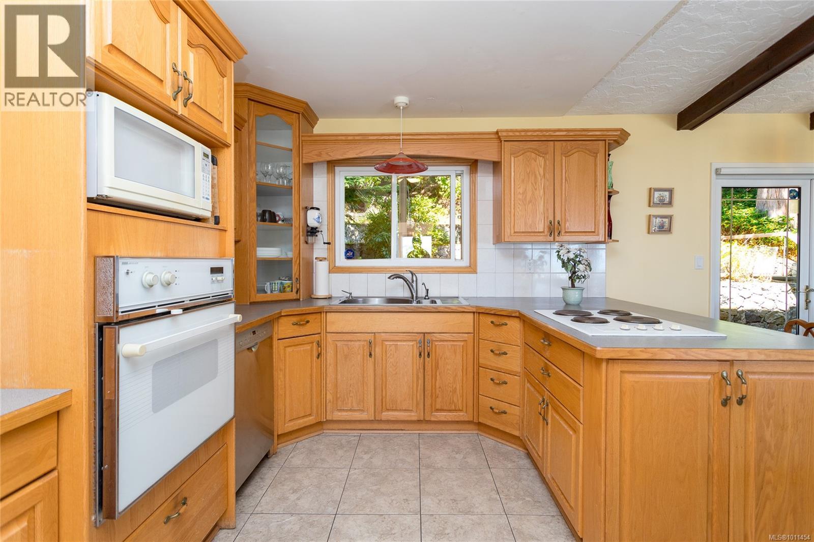 Photo 11 of 4964 Lochside Dr, Saanich BC