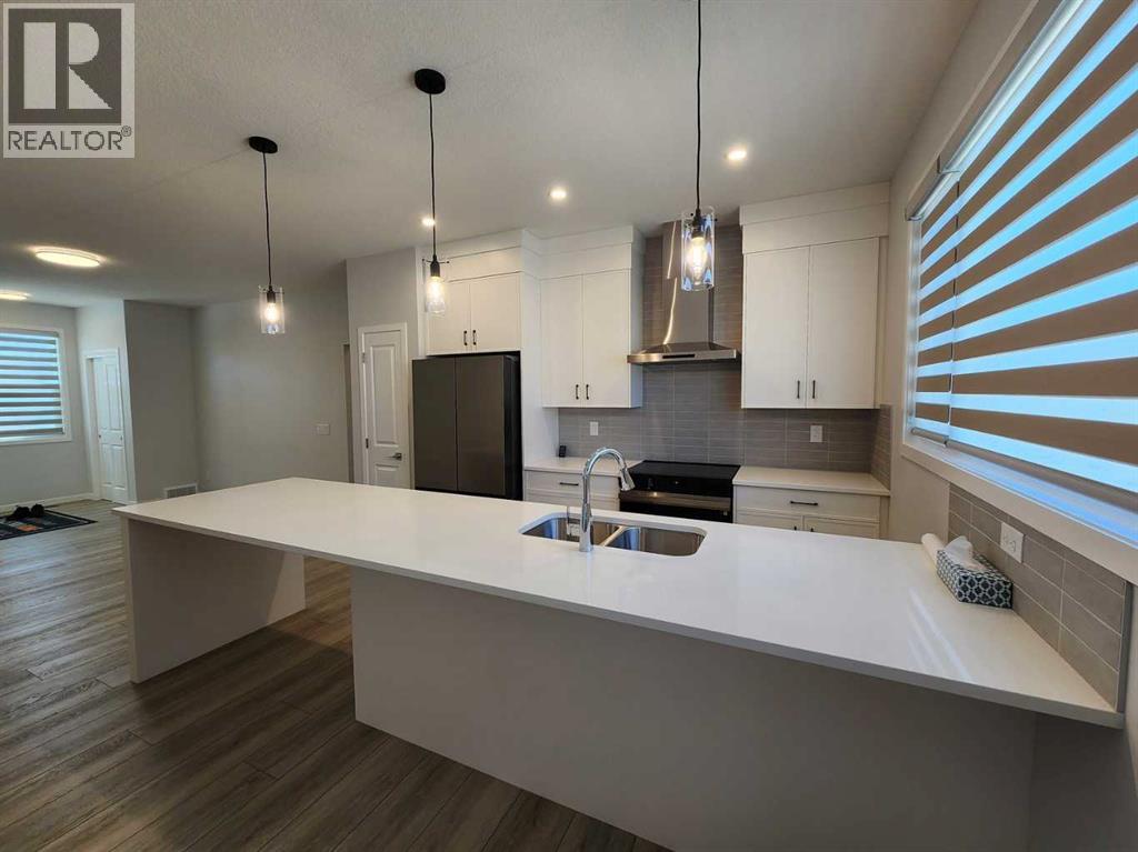 Single Family House Bungalow for Sale in  Herron Common NE Livingston Calgary 