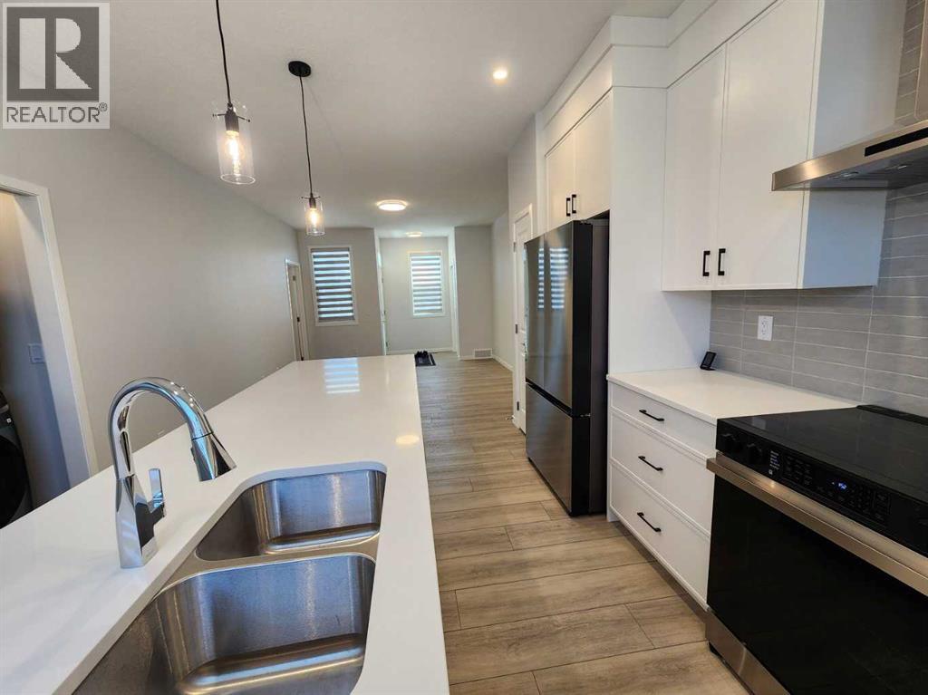 Single Family House Bungalow for Sale in  Herron Common NE Livingston Calgary 