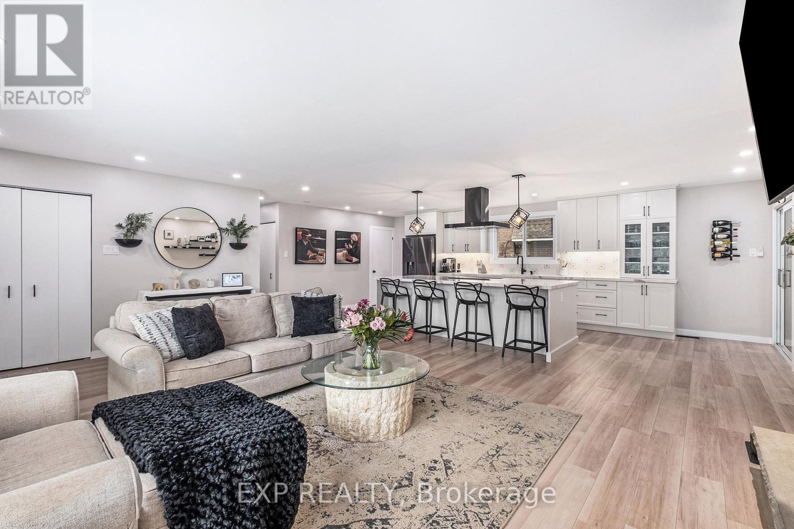 Bright space with luxury vinyl and pot lights