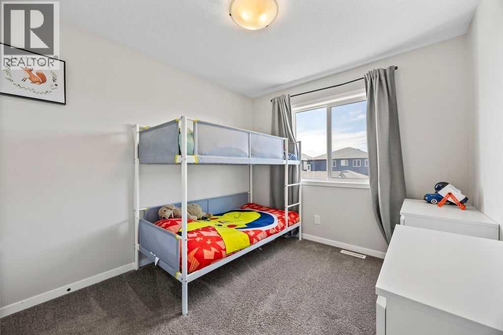 Photo 23 of 42 Wolf Creek Manor Se, Calgary AB