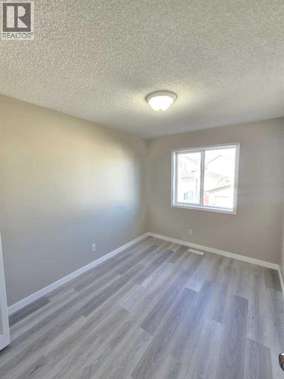 Single Family House Bi-level for Sale in  tarington Manor Taradale Calgary 