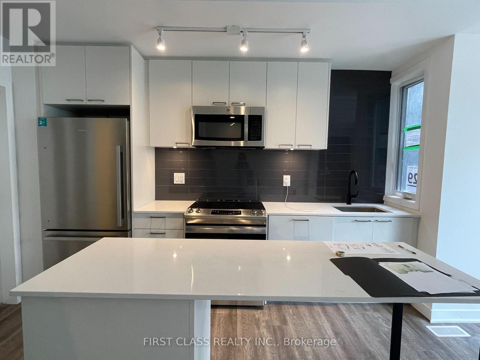 Photo 3 of Th 13 20 Ed Clark Gardens, Toronto ON