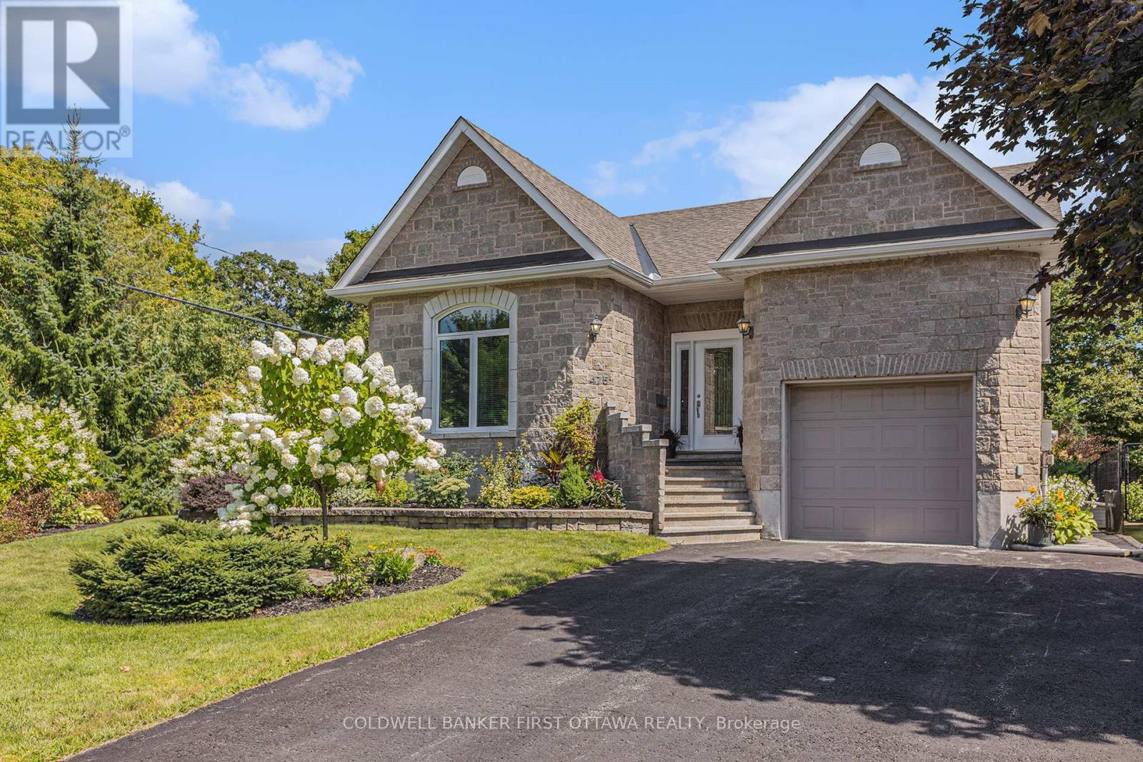 Well-appointed stone-faced home with in-law suite