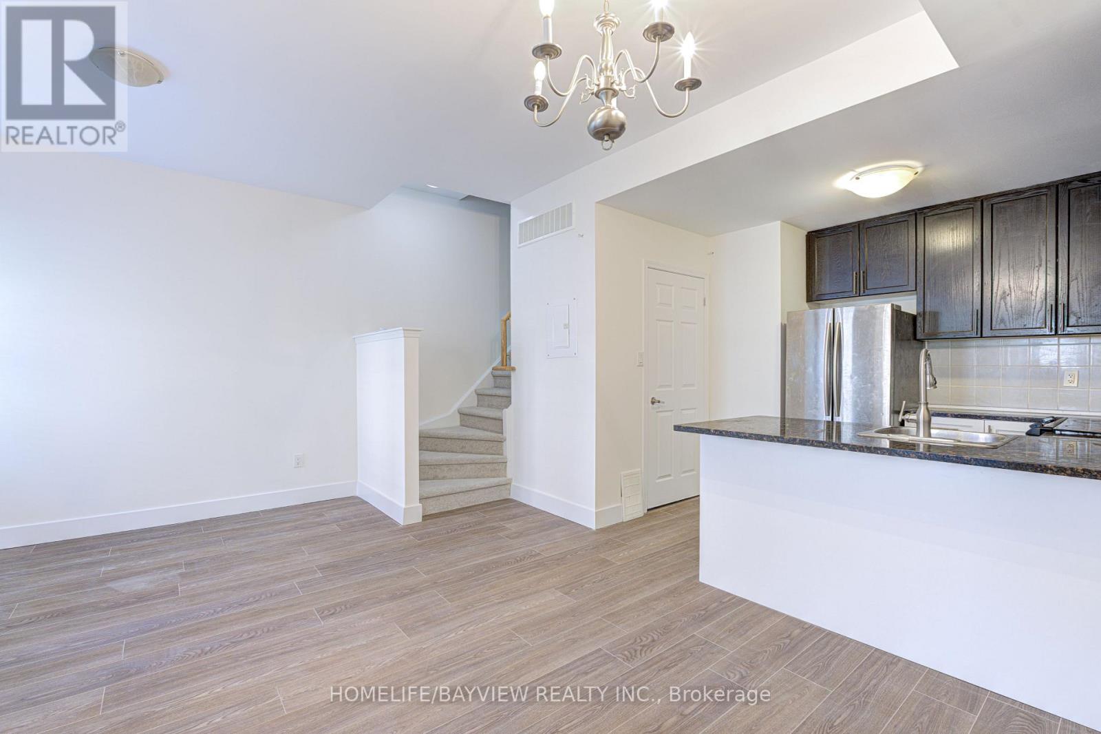 Photo 12 of Th 12 25 Coneflower Crescent, Toronto ON