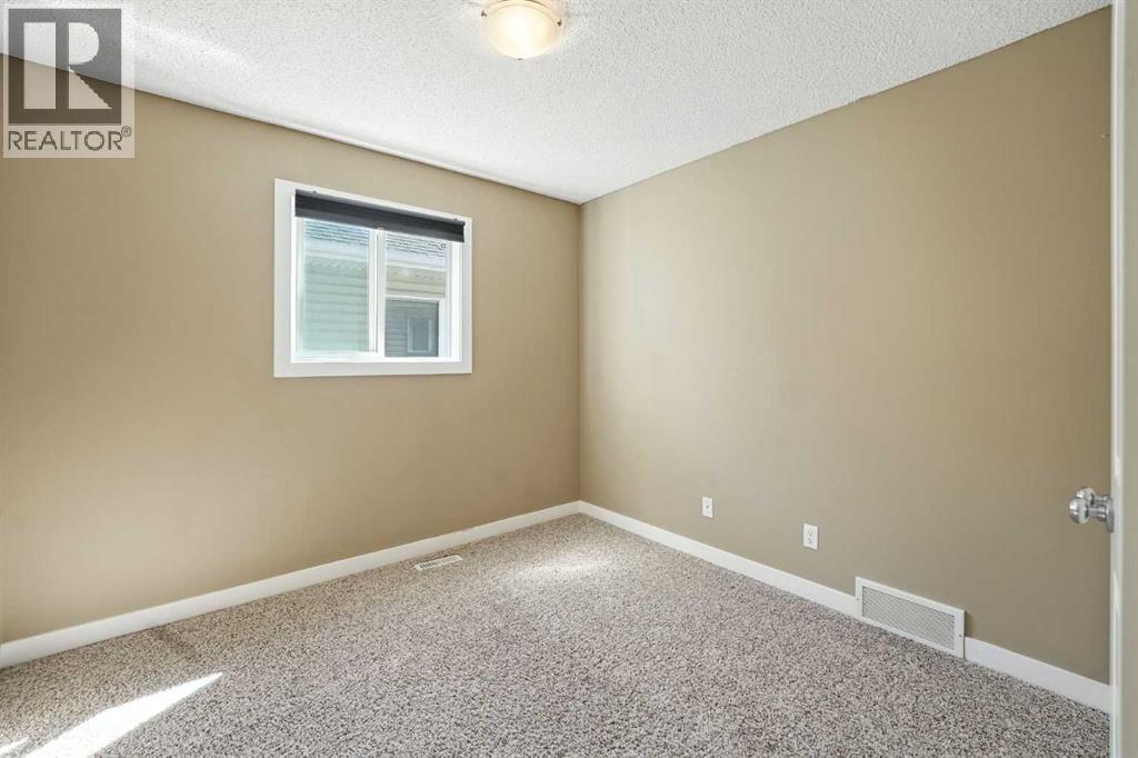 Photo 17 of 124 Kingsbridge Way Se, Airdrie AB