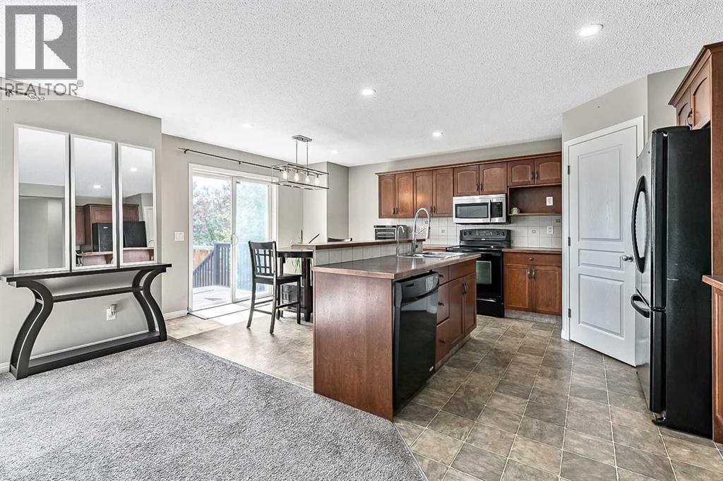 Photo 40 of 117 Channelside Cove Sw, Airdrie AB