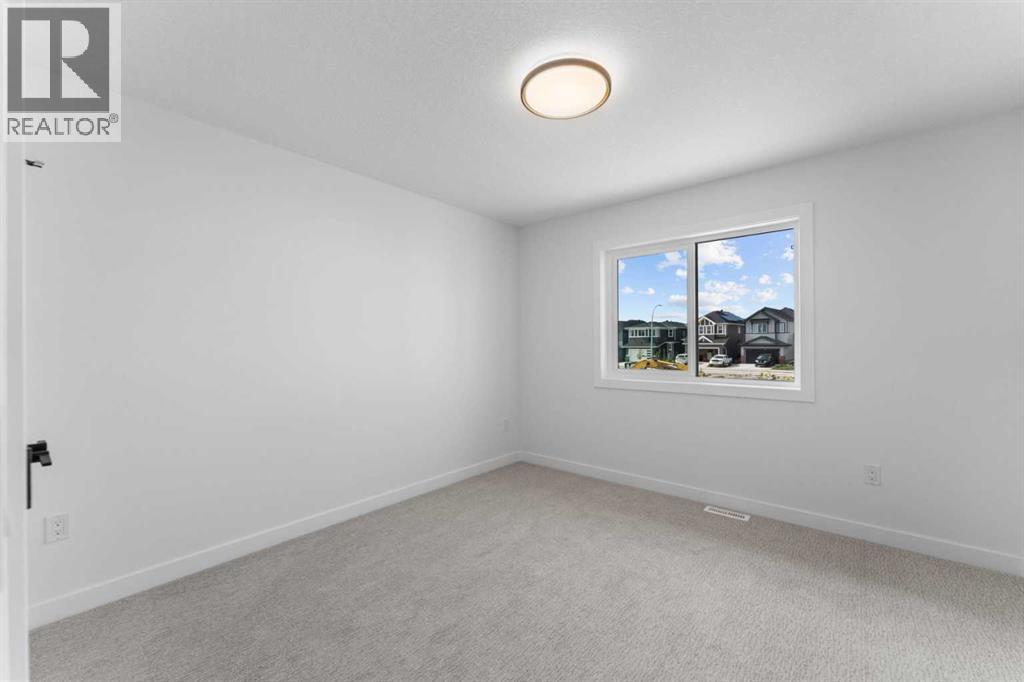 Photo 20 of 129 Heritage Boulevard, Cochrane AB
