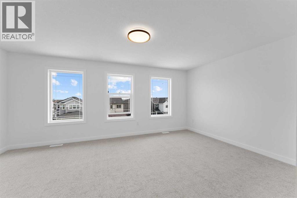 Photo 43 of 129 Heritage Boulevard, Cochrane AB