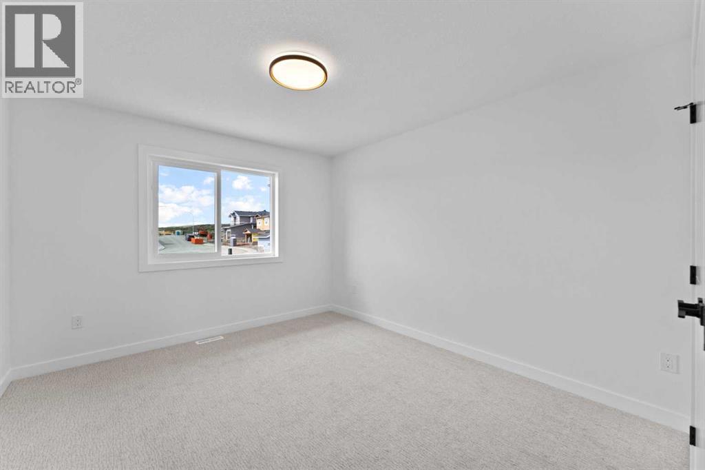 Photo 30 of 129 Heritage Boulevard, Cochrane AB