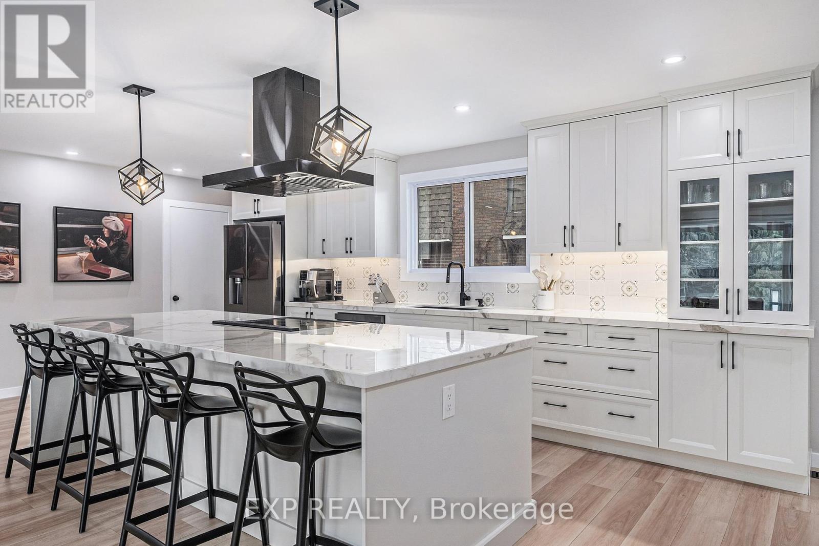 Bright European tile backsplash and chefs hood