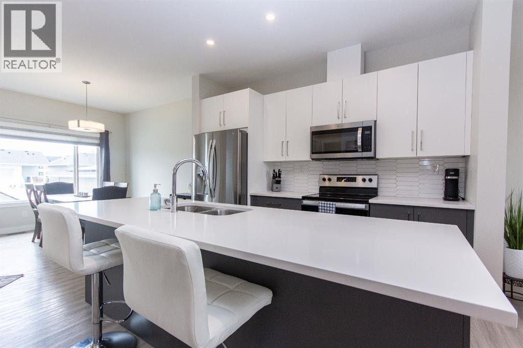 Single Family House Bi-level for Sale in  Ellington Crescent Evergreen Red Deer 