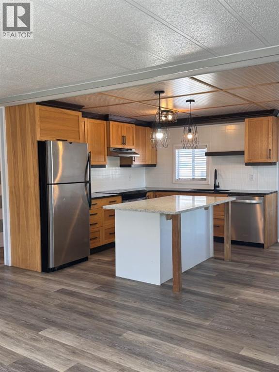 Photo 7 of 128 Huntwell Road Ne, Calgary AB