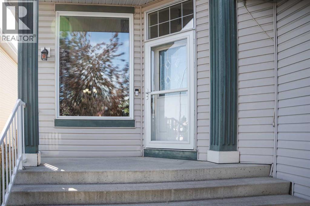 Photo 3 of 445 Rocky Ridge Bay Nw, Calgary AB