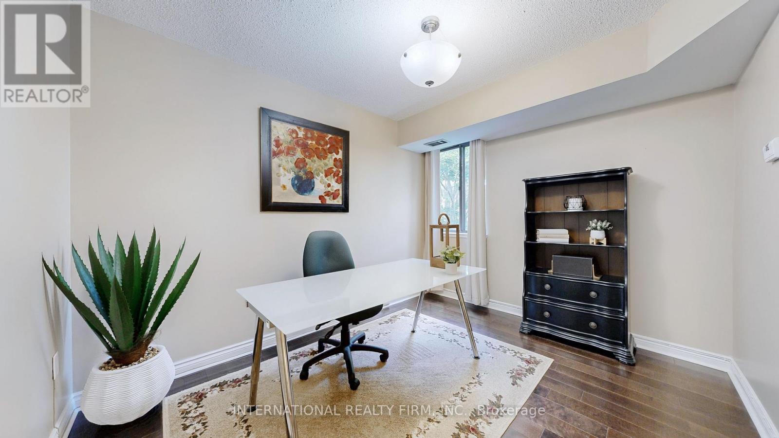 Photo 11 of 404 1200 Bridletowne Circle, Toronto ON