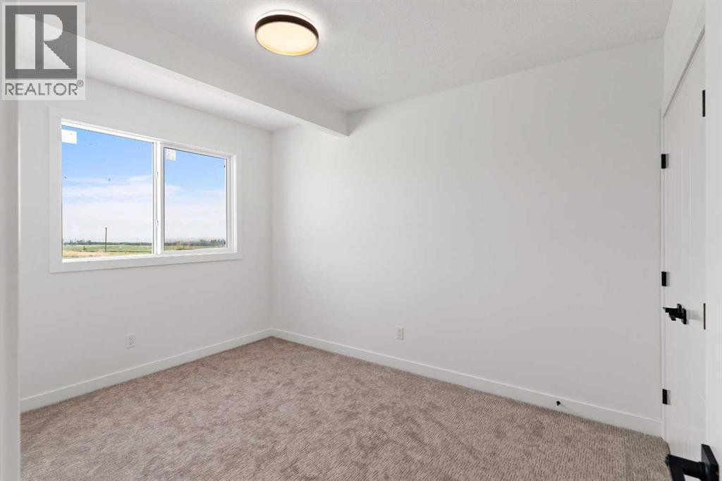 Photo 40 of 1192 Iron Ridge Avenue, Crossfield AB