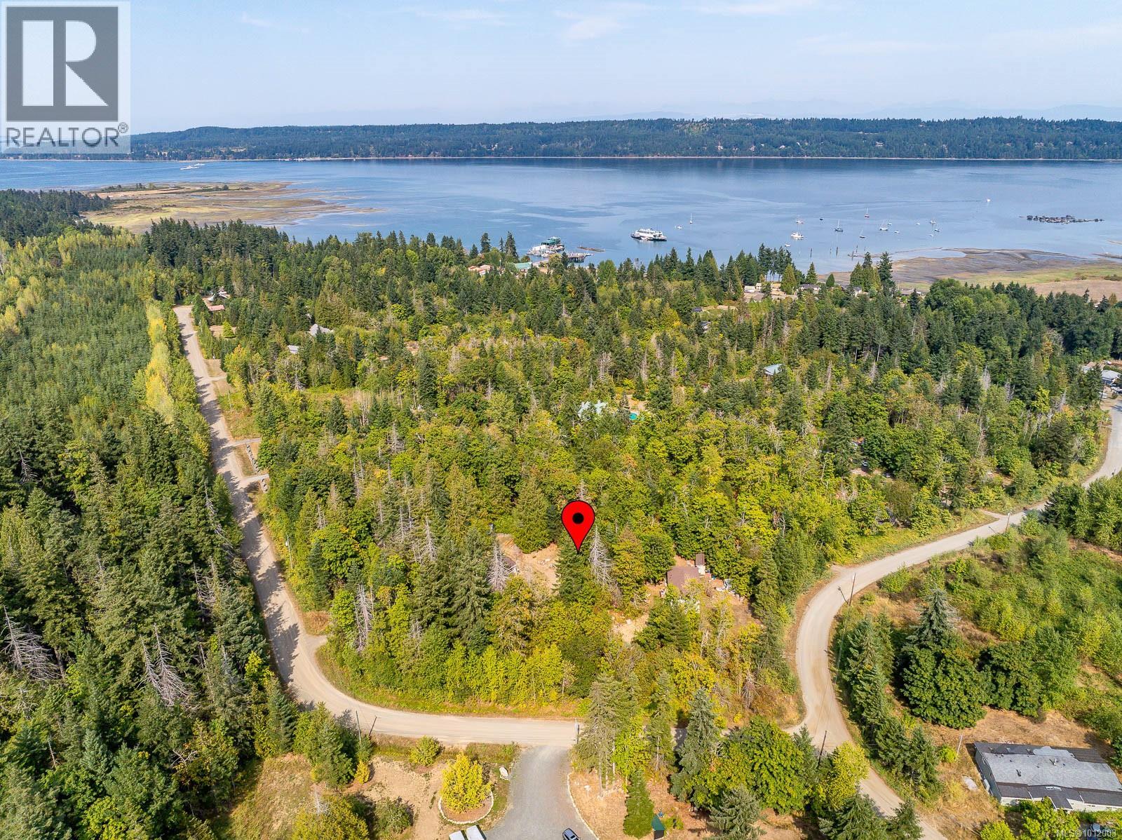 Photo 2 of 7390 Cougar Smith Rd, Fanny Bay BC