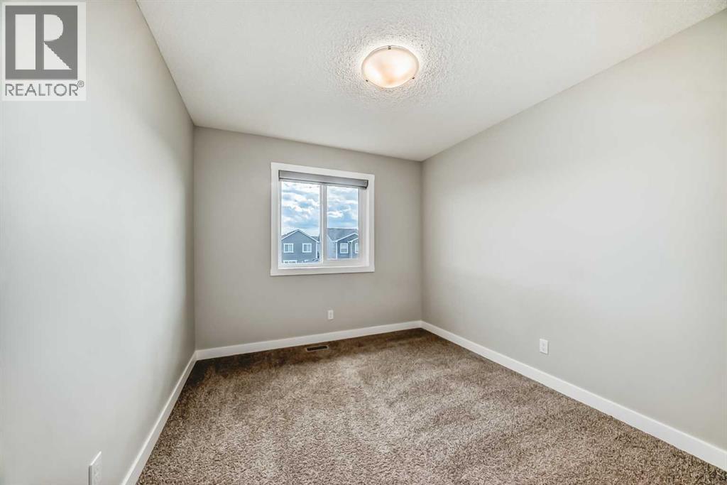 Photo 19 of 221 Midgrove Mews Sw, Airdrie AB