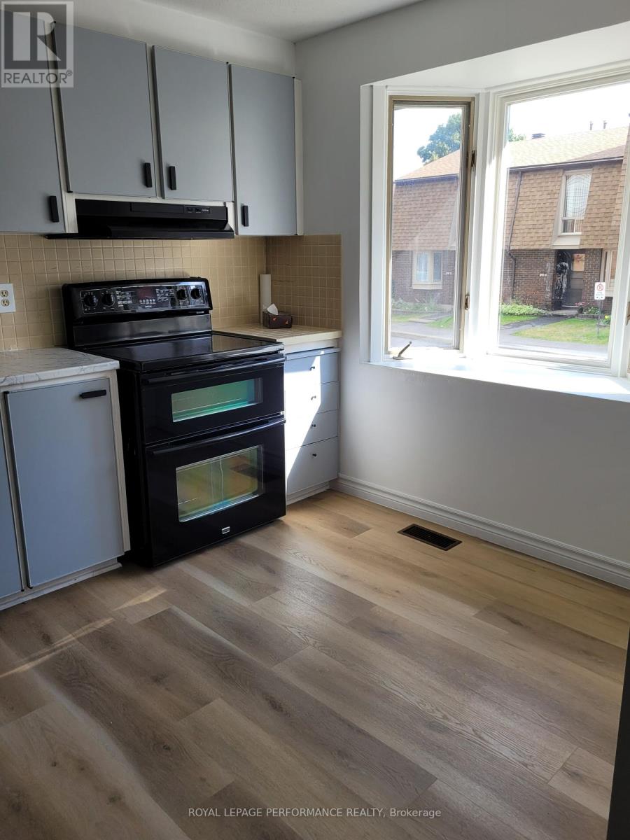 Kitchen with new vinal laminate flooring.