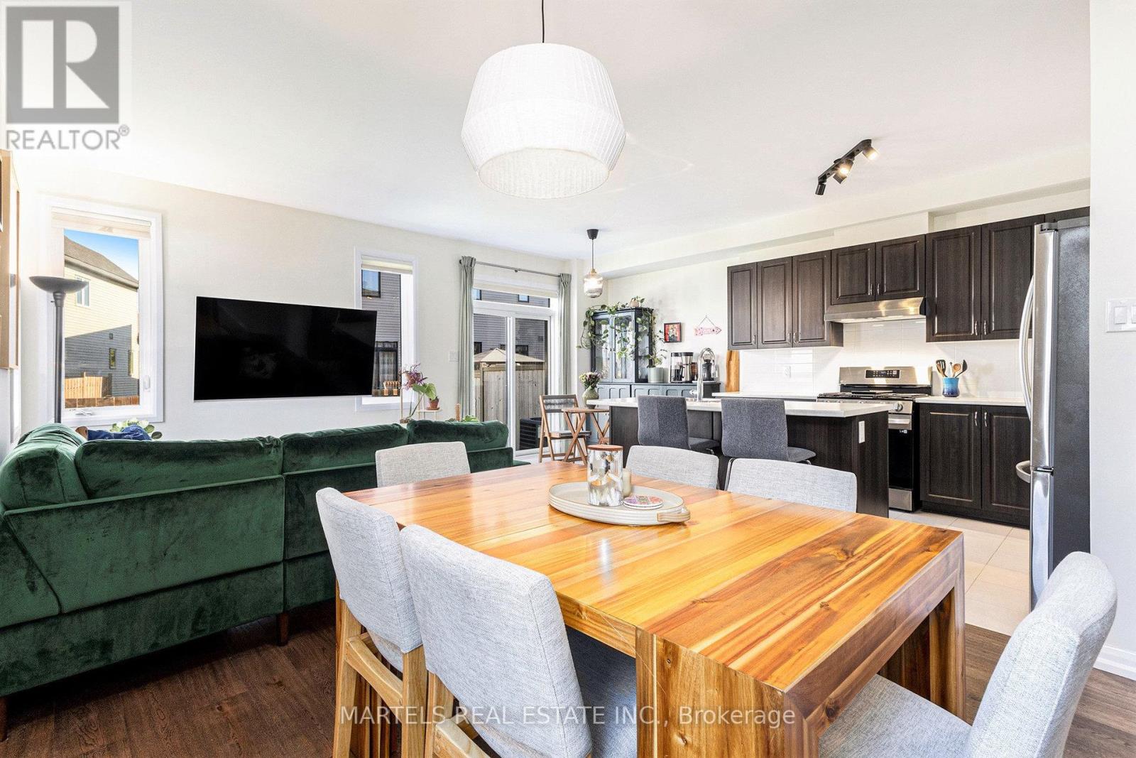 Large open concept is highlighted by neutral décor