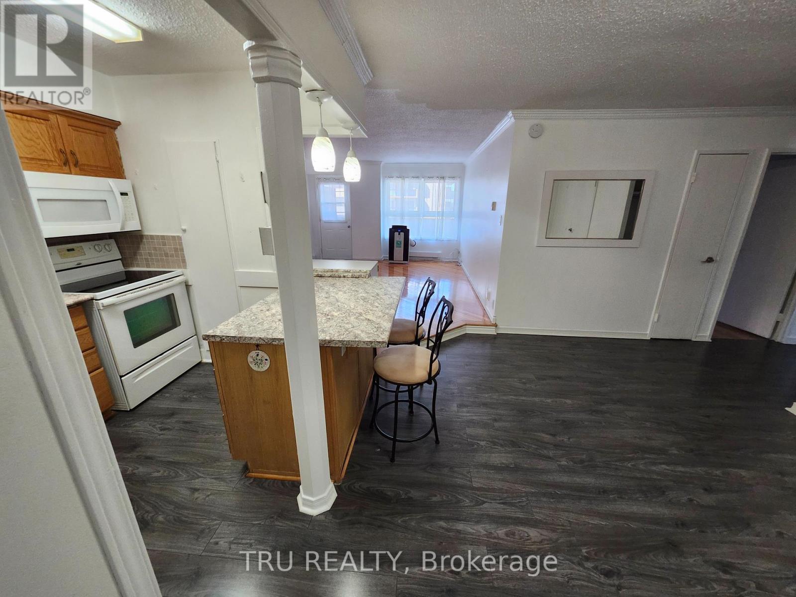 Breakfast bar open to living/dining.