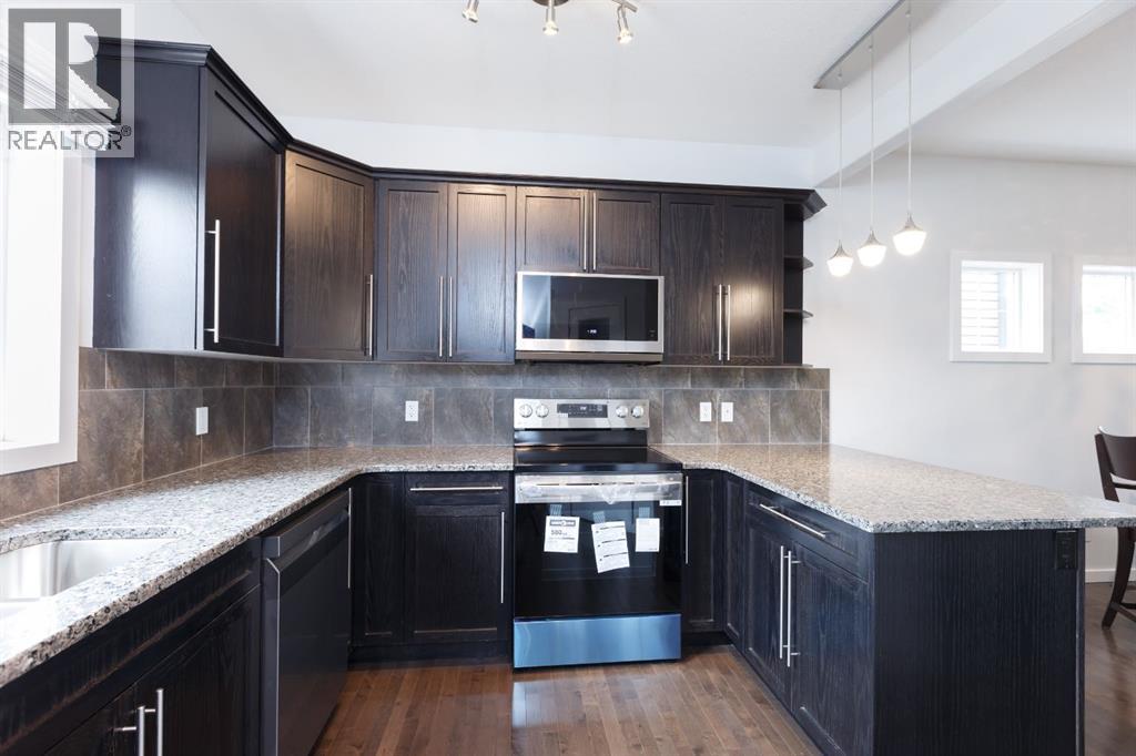 Photo 5 of 2461 Ravenswood View Se, Airdrie AB