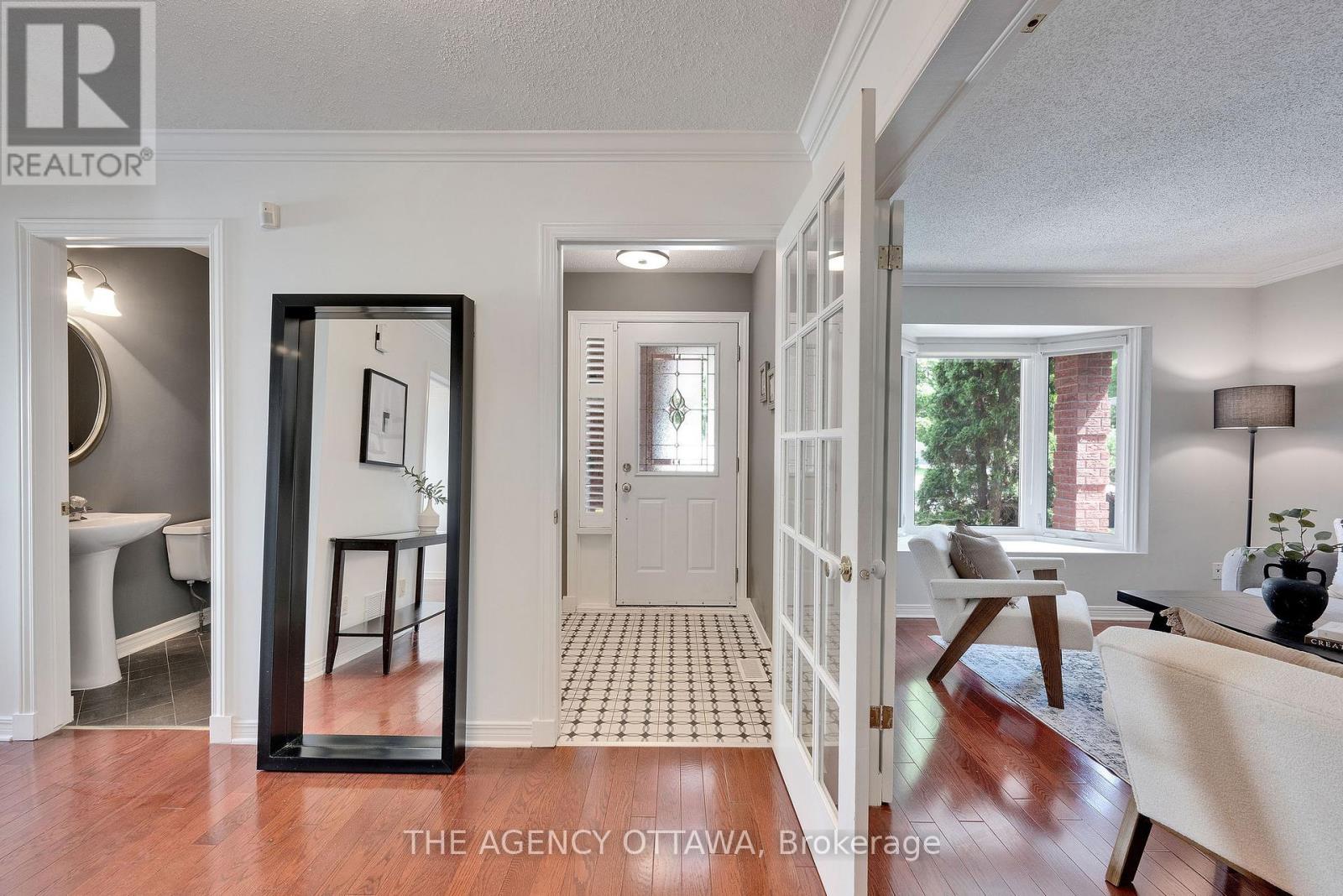 Front Entrance - Powder Room to the Left