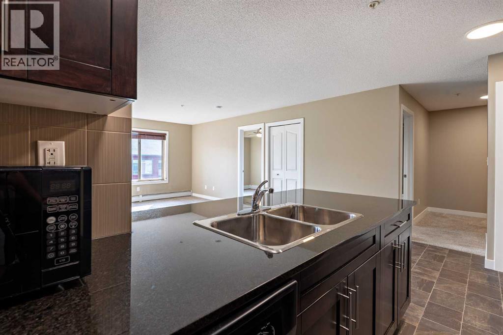 Photo 8 of 1407 403 Mackenzie Way Sw, Airdrie AB