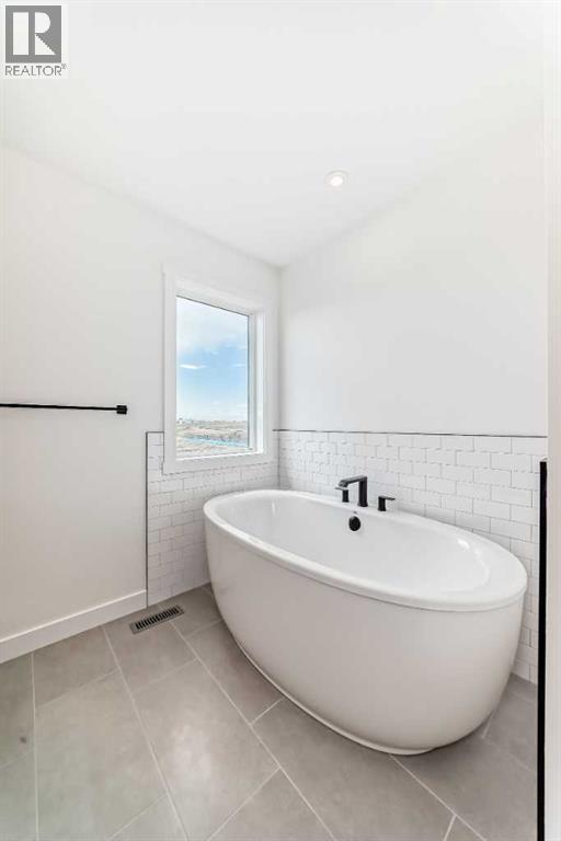 Photo 25 of 116 Southbow Village Way, Cochrane AB