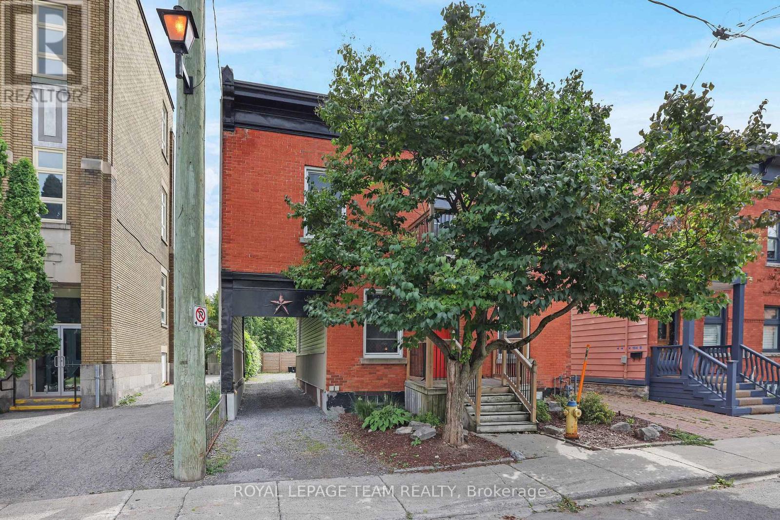Handsome brick fronted duplex. Porch rebuilt.
