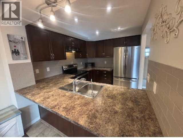 Photo 8 of 3136 Windsong Boulevard Sw, Airdrie AB