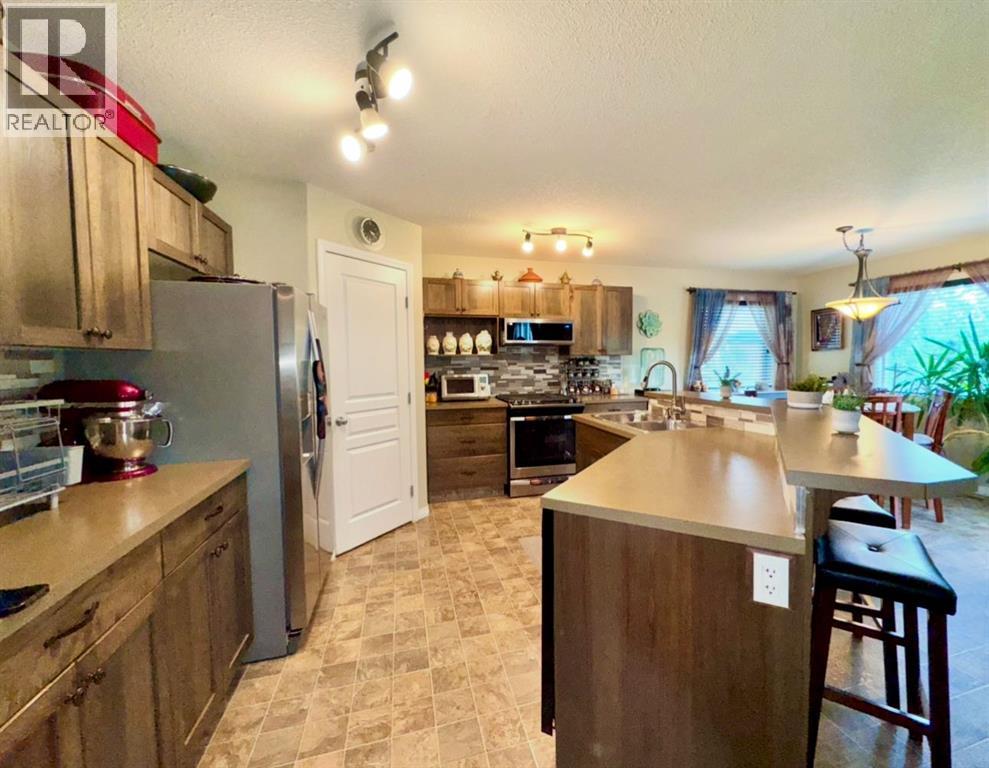 Photo 6 of 160 Rainbow Falls Grove, Chestermere AB