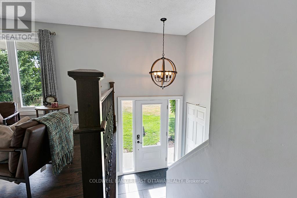 White and bright foyer has ceramic floor