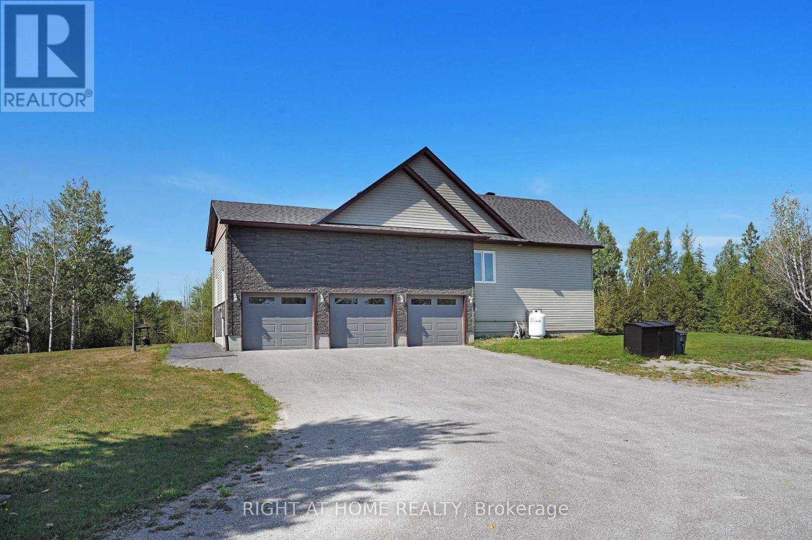 Triple Car Garage with tons of additional parking!