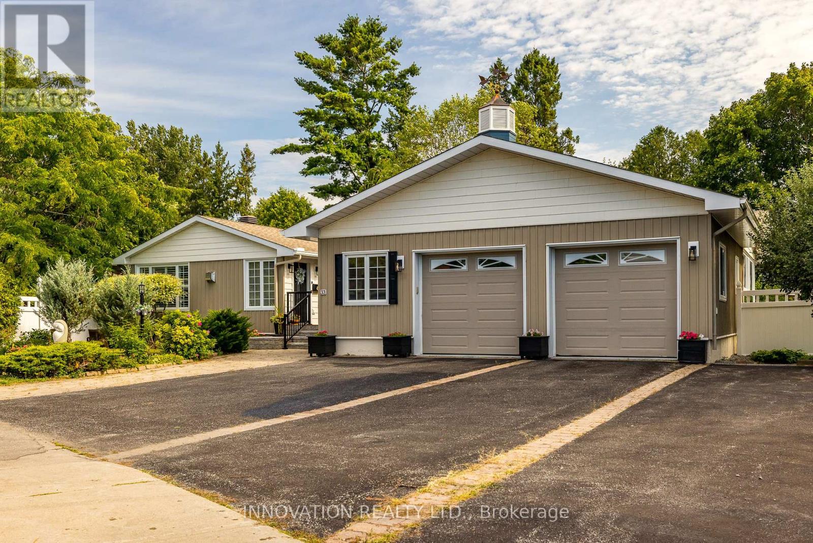 Large driveway with outdoor parking for 8-10 cars.