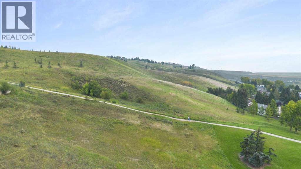 Photo 25 of 65 Carolina Drive, Cochrane AB