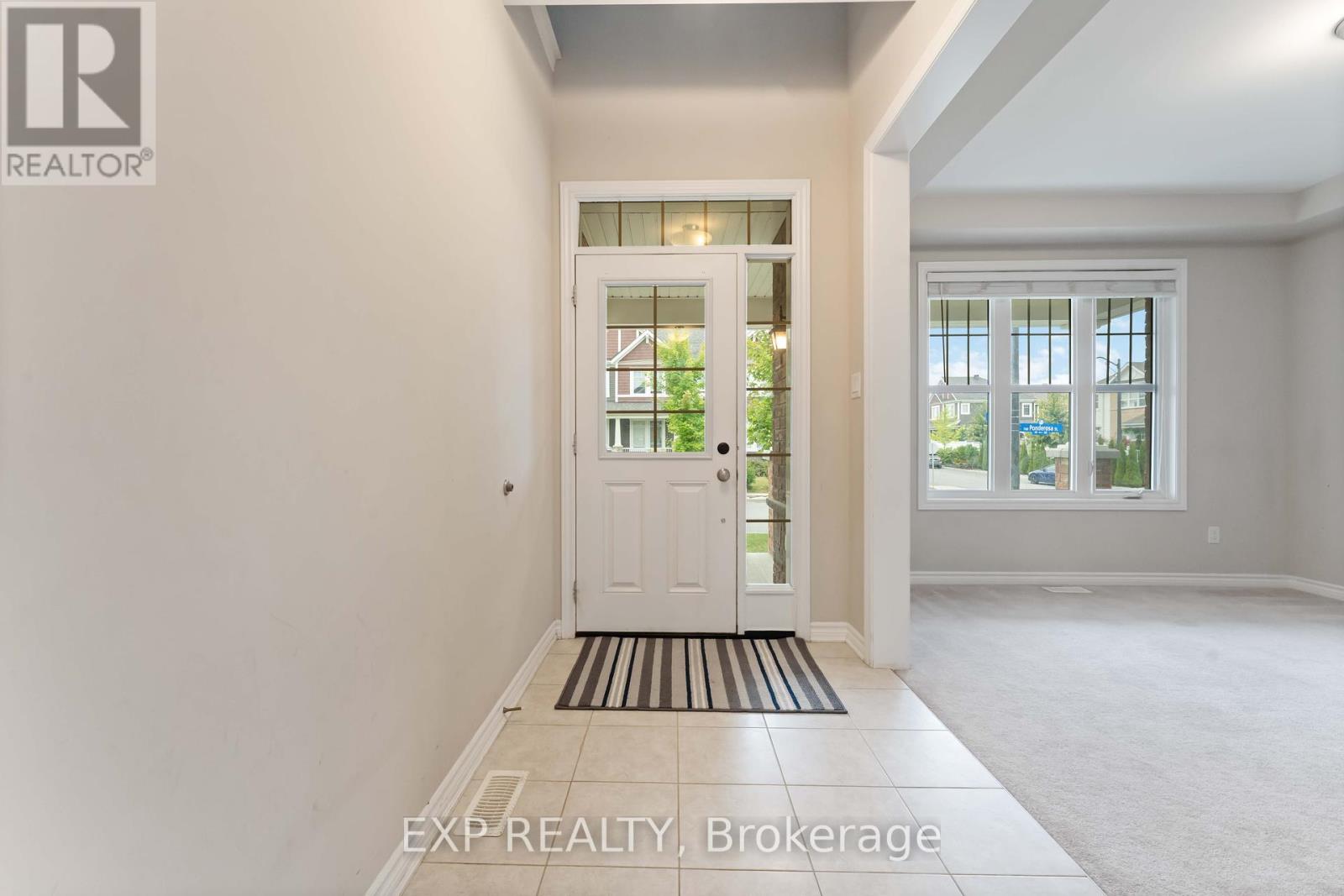 Foyer with ceramic tile and highlighter window