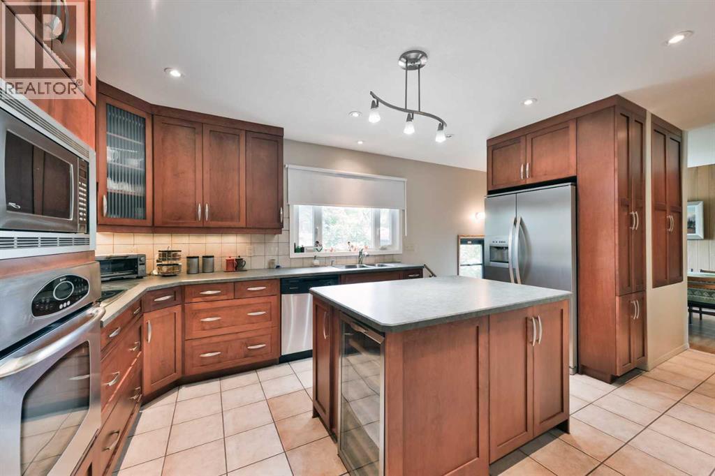 Single Family House Bungalow for Sale in  Layzell Road SW North Glenmore Park Calgary 