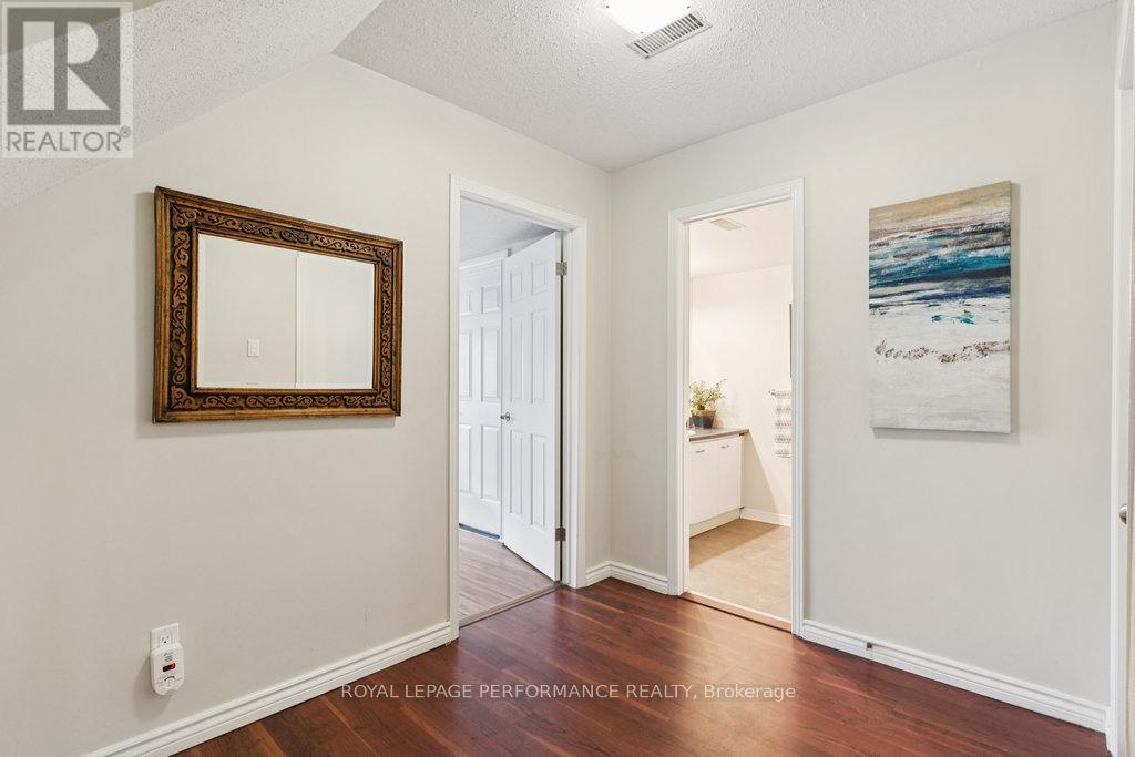 Hall with access to Garage, 3 pc Bathroom & Den.
