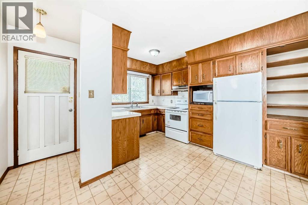 Single Family House Bi-level for Sale in  Barron Drive NW Brentwood Calgary 